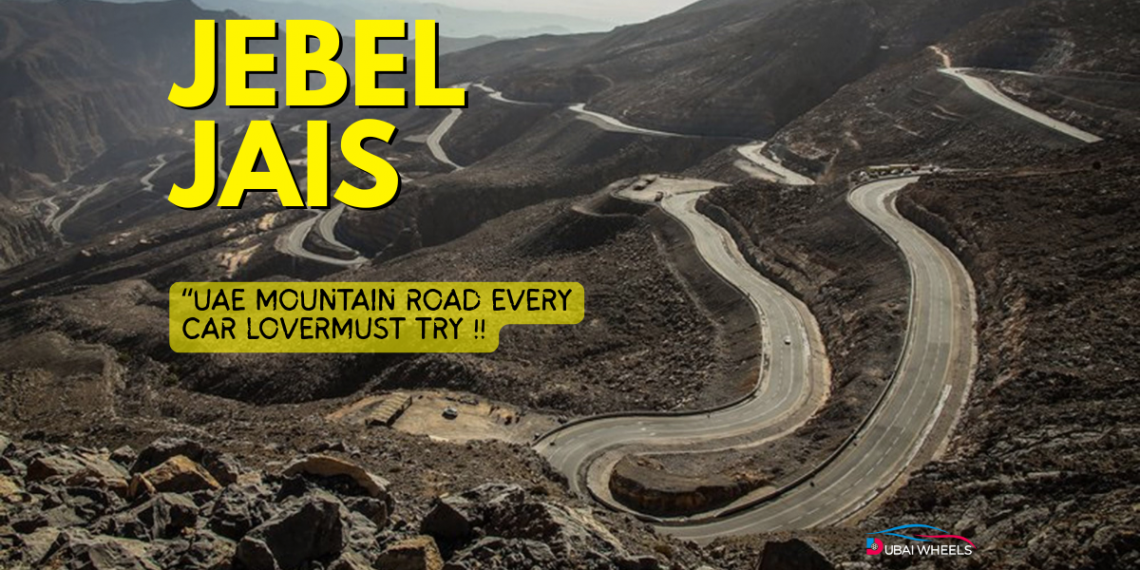 Car driving on Jebel Jais mountain road in Ras Al Khaimah, UAE