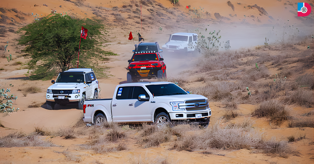 4x4 vehicles driving through desert dunes during the Khaleej Times Desert Drive in the UAE