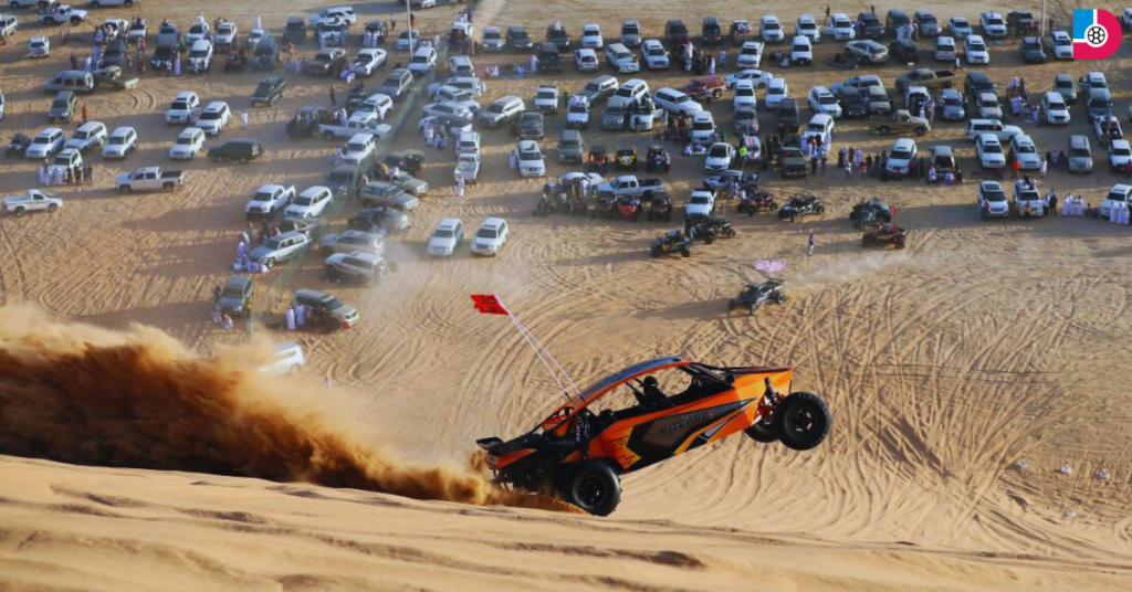 Powerful off-road vehicles racing across Liwa Desert during the Liwa International Festival in the UAE