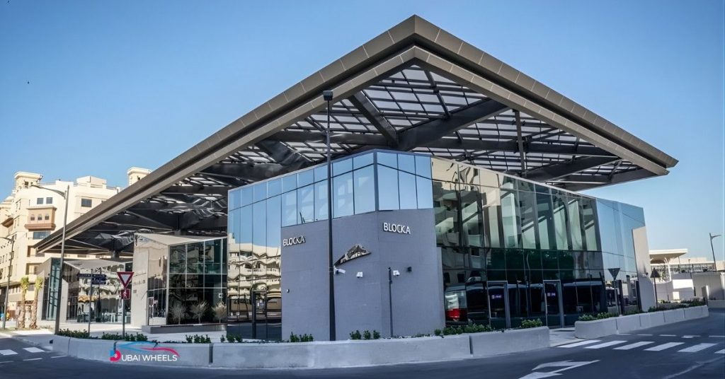 Al Ghubaiba Bus Station Dubai with tourists, showing connectivity to Dubai Museum, Al Fahidi Historical District, Dubai Creek Abra Station, Meena Bazaar, and Old Souk