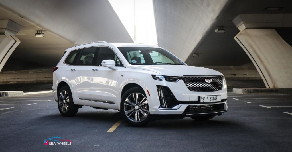 Cadillac cars in UAE lineup showing Escalade, Lyriq and XT models with prices and luxury features