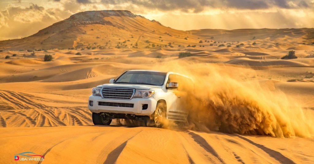 4x4 vehicle prepared for desert driving in the UAE, showing tyre pressure check, traction control, air filter maintenance, and off-road safety equipment.