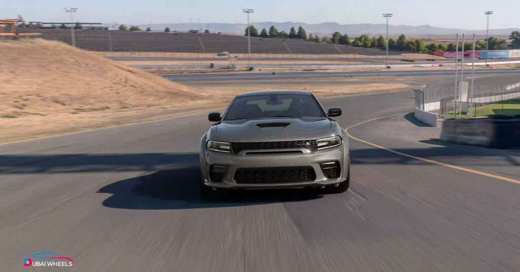 Dodge Charger UAE Review compared with competitors showing stronger engine, aggressive styling, and better road presence