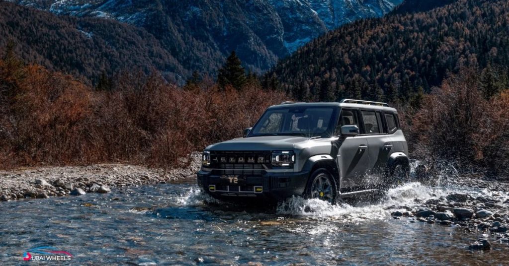 Jetour T2 tackling desert dunes and gravel trails in Abu Dhabi 2025 – showcasing off-road capability and comfort for UAE adventures