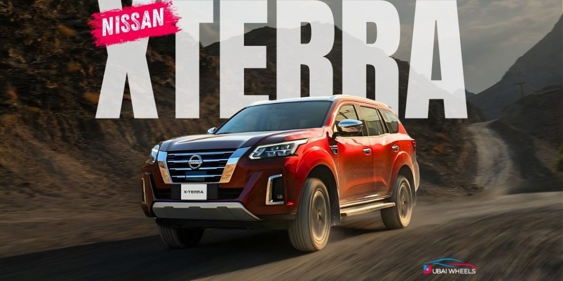 2025 Nissan Xterra UAE 4x4 SUV driving on desert dunes and rocky terrain