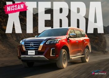 2025 Nissan Xterra UAE 4x4 SUV driving on desert dunes and rocky terrain