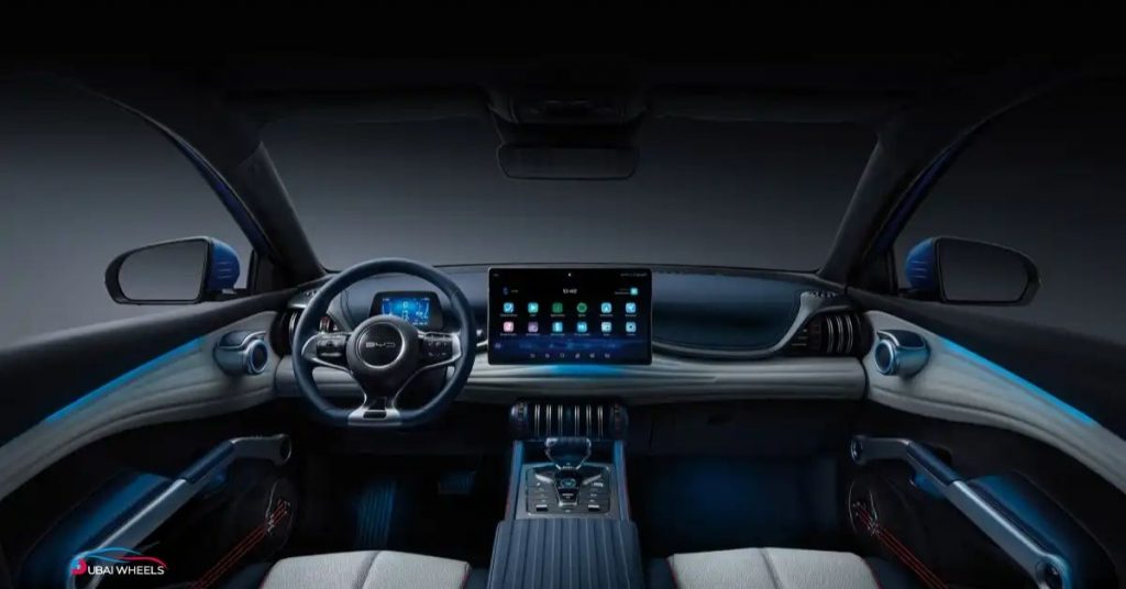 BYD Atto 3 UAE interior showing rotating infotainment screen, ambient lighting, and spacious cabin