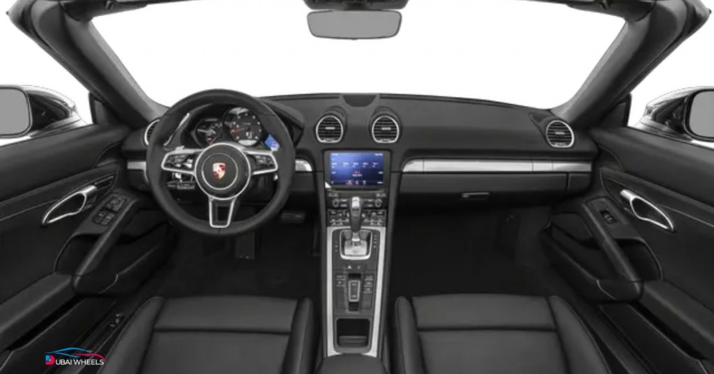 Porsche 718 Boxster interior in UAE showing driver-focused cockpit and infotainment layout
