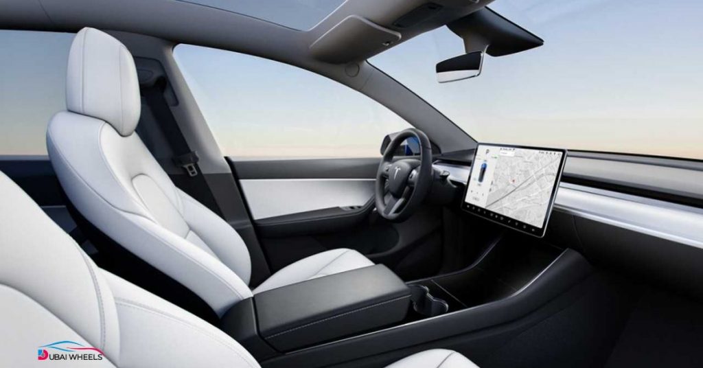 Tesla Model Y interior UAE with 15-inch central touchscreen, minimalist cabin design, optional third-row seats, and high-tech features