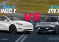 Tesla Model Y vs BYD Atto 3 UAE electric SUVs side by side with Dubai skyline, showing futuristic design and practical city SUV features