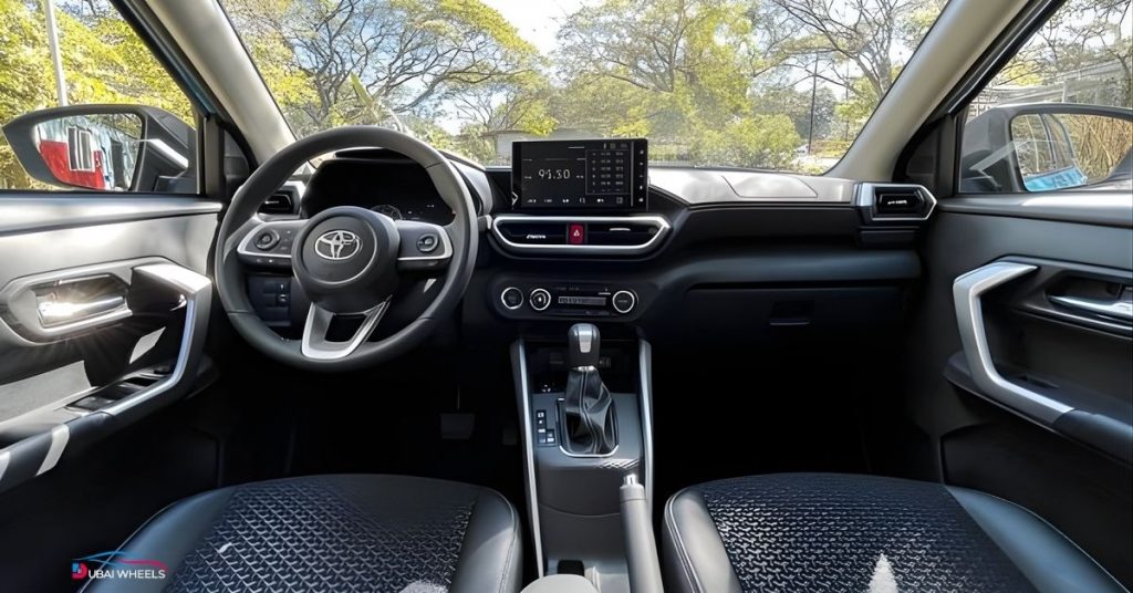 Toyota Raize interior UAE showing dashboard, infotainment, and front cabin layout