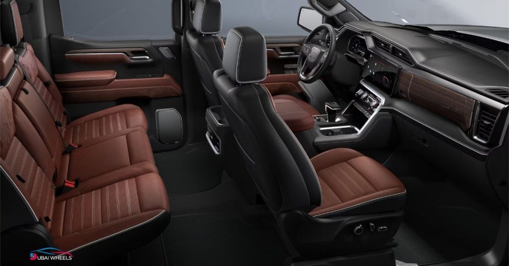 Ford F-150 Lariat vs GMC Sierra LD interior UAE comparison showing premium leather seats, dashboard and cabin design