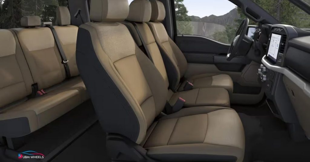 Ford F-150 Lariat vs GMC Sierra LD UAE 2026 Ford F-150 Lariat interior showing digital dashboard, leather seats and infotainment system