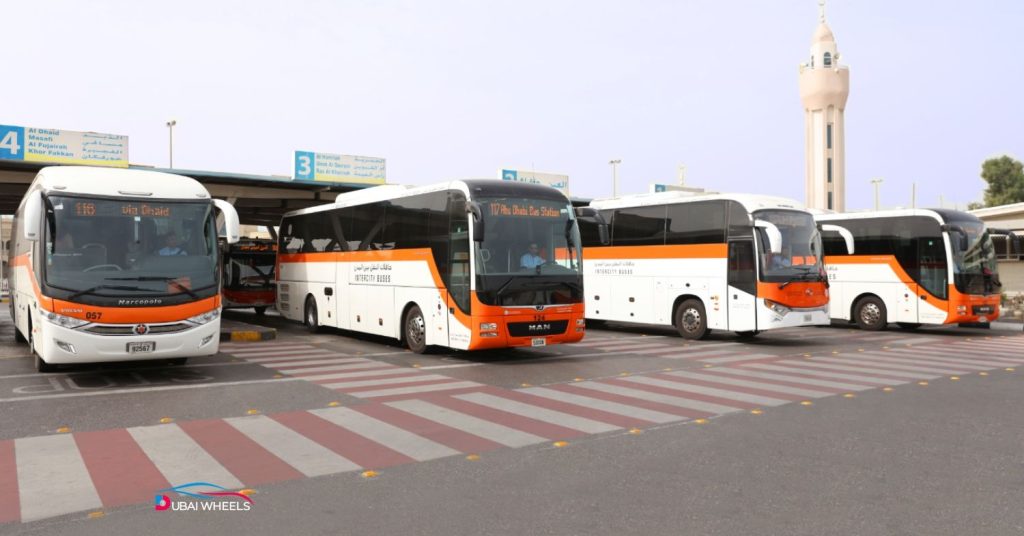Al Jubail Bus Station Sharjah showing multiple buses, commuters, and efficient intercity connections
