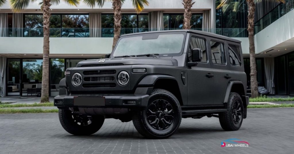 212 T01 Petrol UAE driving on desert sand showcasing durability and off-road capability