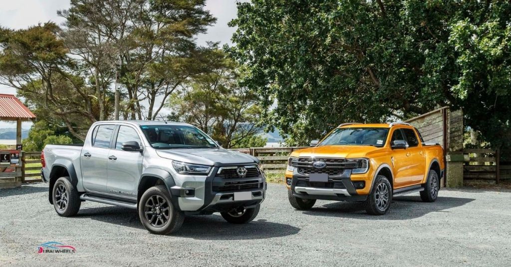 Ford Ranger Wildtrak 4X4 vs Toyota Hilux Invincible front design comparison showing modern styling and rugged toughness in UAE